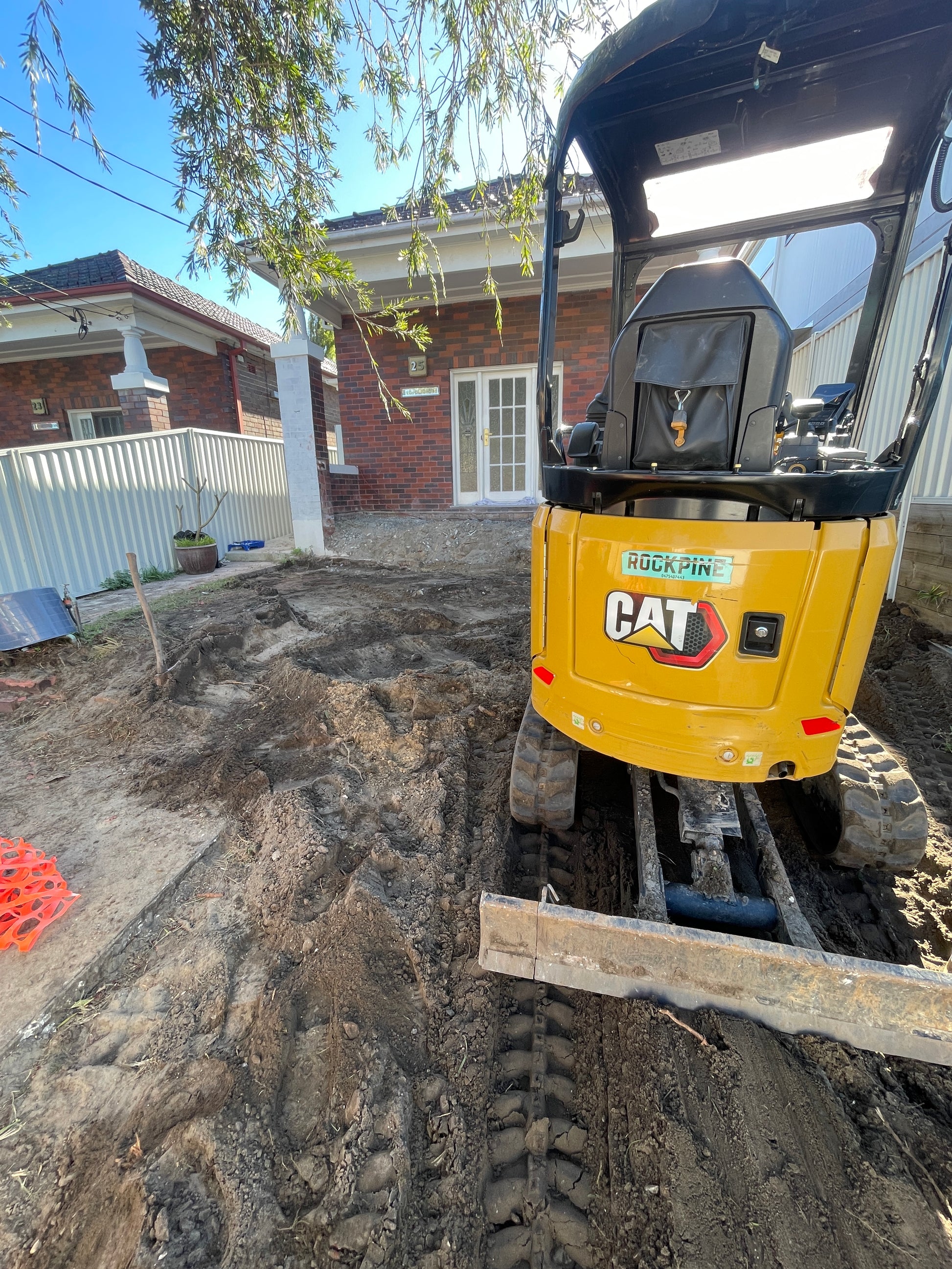 Excavator tight access residential construction in Mascot